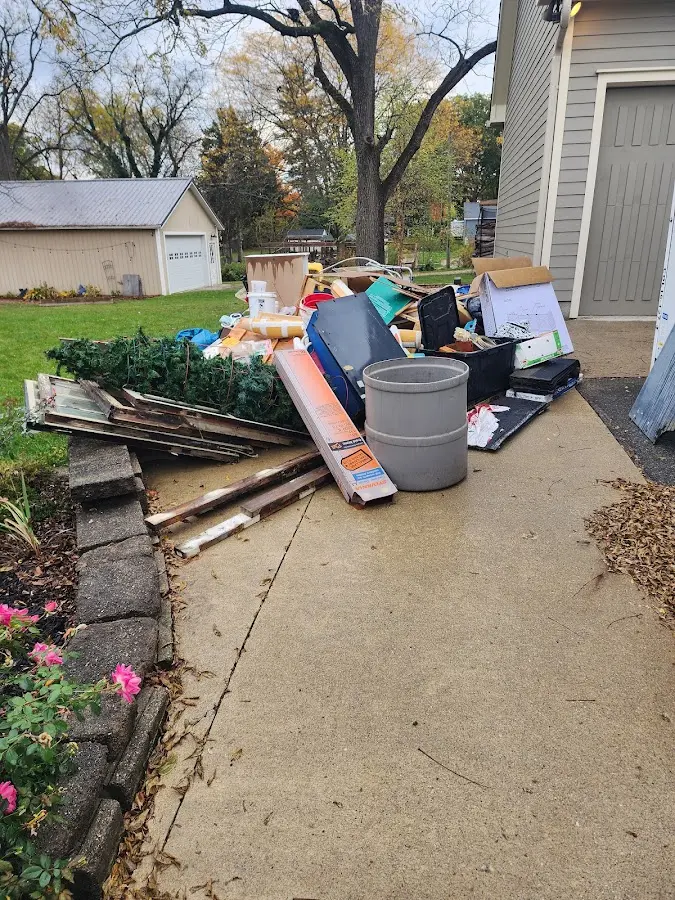 Dumpster being loaded with debris for Commercial Dumpster Rental in Saukville